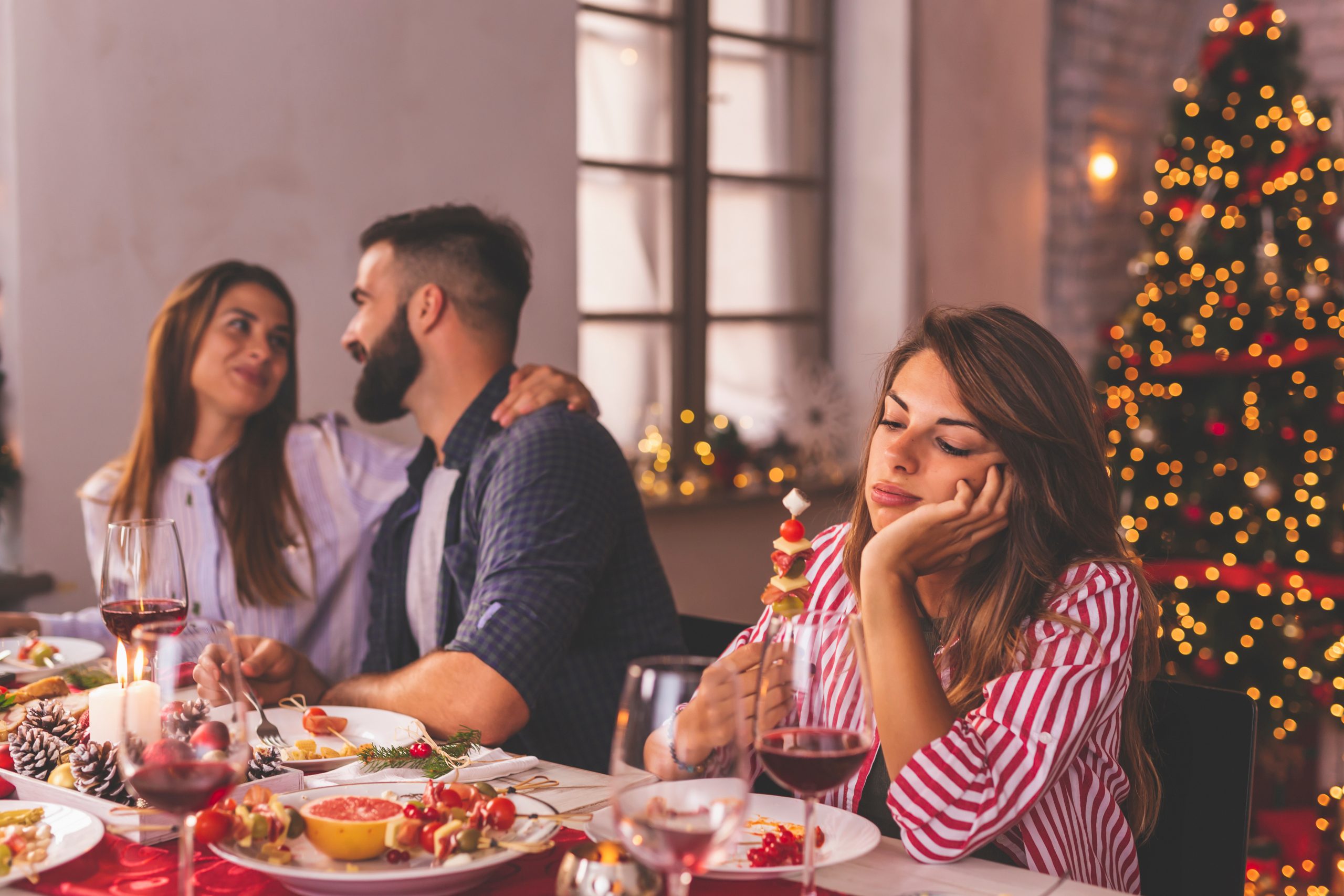 Woman sad at holiday dinner